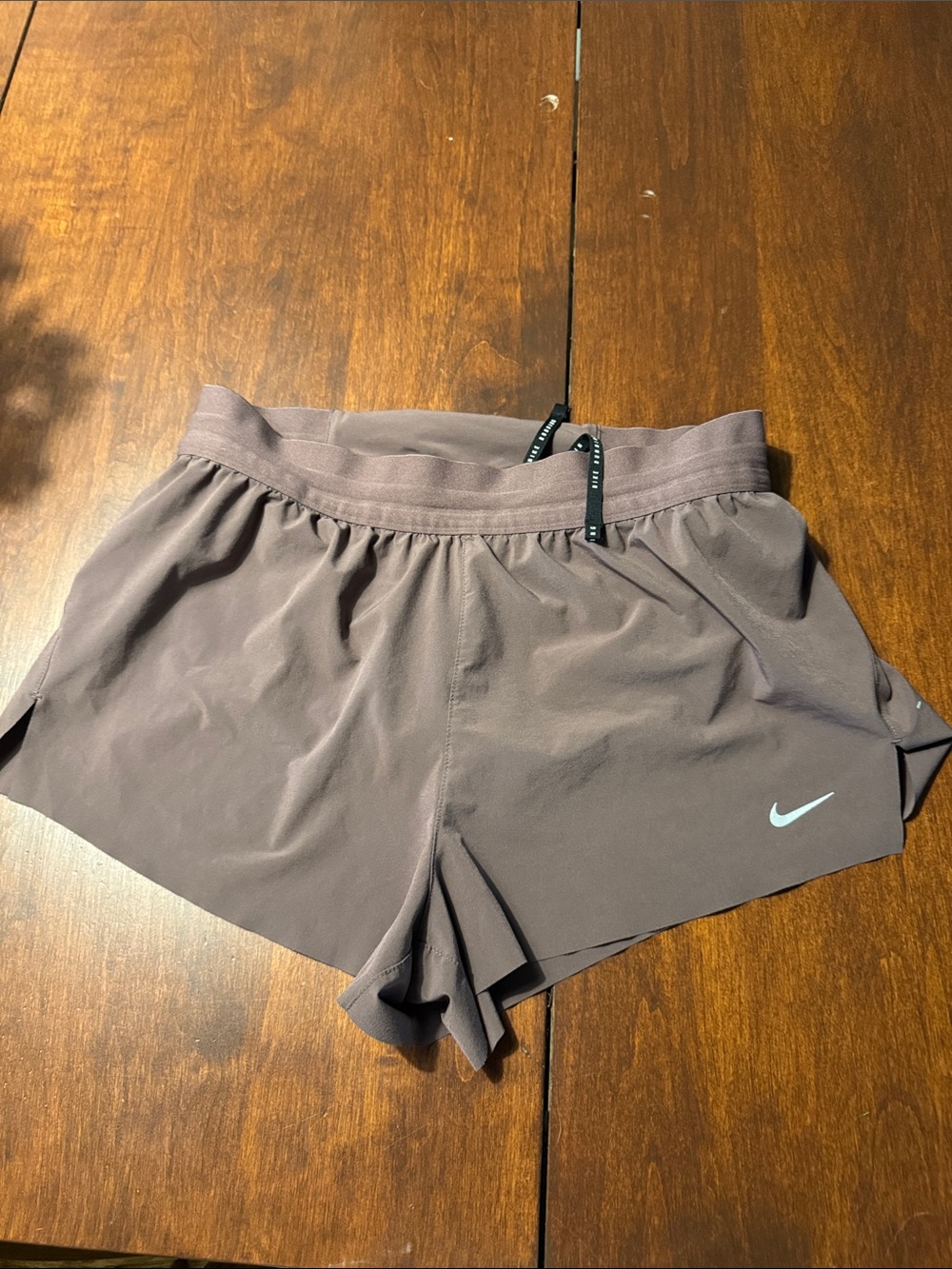 Nike Women's Taupe Athletic Running Shorts with Light Blue Swoosh